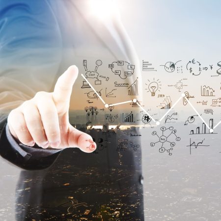 businessman-pointing-graphs-symbols (1)